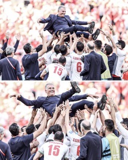 Iran tossed coach Carlos Queiroz in the air after their late win against Wales
